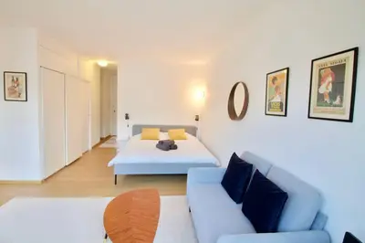 a living room with a bed and a couch at New Studio ! in Brussels