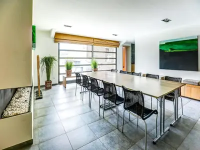a conference room with a long table and chairs at Apartment in Weelde with swimming pool in Weelde