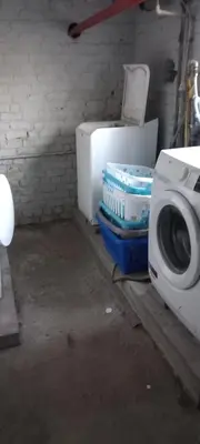 a bathroom with a toilet and a washing machine at Wenceslas Cobergher Penthouse in Boutersem