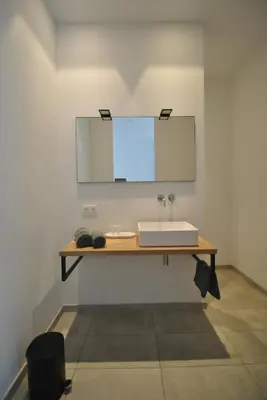 a bathroom with a sink and a mirror at Paulus41 in Antwerp
