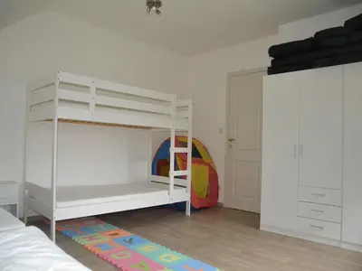 a bedroom with a white bunk bed with a ladder at Apartment in Antwerp near Verbeke Museum in Puivelde