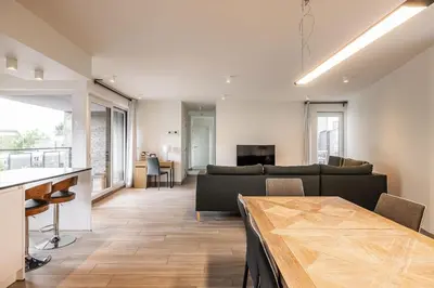 a living room with a couch and a table at Red Rabbit Tourist and Business Flats with indoor parking - 1 to 5 or 6p - region gnt antwp brux in Zele