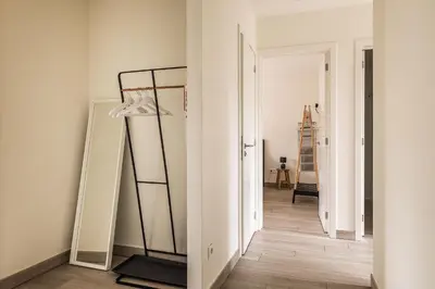 a dressing room with a mirror at Red Rabbit Tourist and Business Flats with indoor parking - 1 to 5 or 6p - region gnt antwp brux in Zele