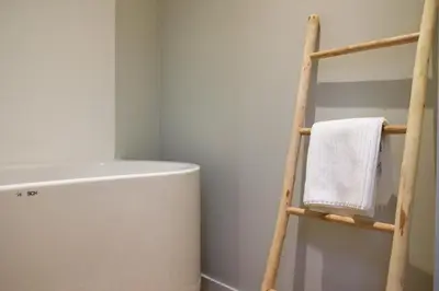 a towel ladder in a bathroom next to a toilet at Margareta Stay in Mechelen