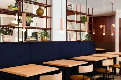 a row of tables and chairs in a restaurant at Residence Inn by Marriott Brussels Airport in Diegem