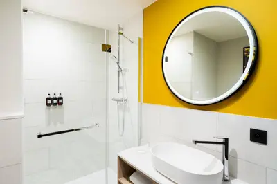 a bathroom with a sink and a mirror at Residence Inn by Marriott Brussels Airport in Diegem