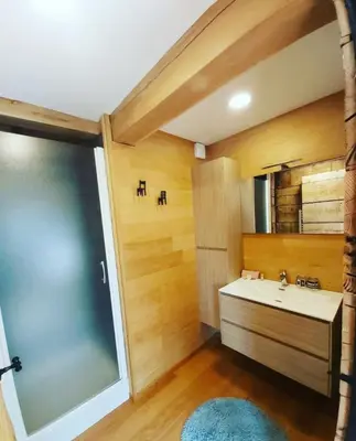 a bathroom with a sink and a large window at De linderd in Aalst