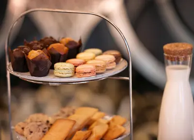 a tray of pastries and cookies on a plate at Juliana Hotel & Spa - Brussels Centre in Brussels