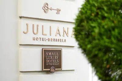 a sign on the side of a hotel building at Juliana Hotel & Spa - Brussels Centre in Brussels