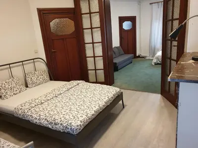 a bedroom with a bed and a living room at Near European District, 1-2 Bedroom Apartment. in Brussels
