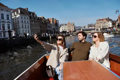 three people on a boat in the water at Van der Valk Hotel Gent in Ghent