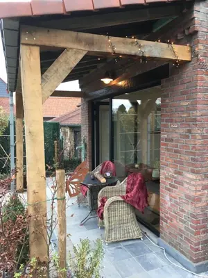 a pavilion with a table and chairs on a patio at B&B Den Biesthoek in Grimbergen