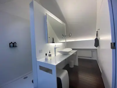 a white bathroom with a sink and a mirror at B&B Villa Tartine in Puurs
