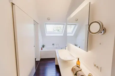 a bathroom with a sink and a mirror at B&B Villa Tartine in Puurs
