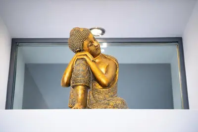 a statue sitting on a shelf in front of a mirror at Apartments Saint Géry in Brussels
