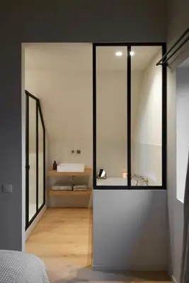a bedroom with a large glass wall with a sink at The Pine House B&B in Schoten