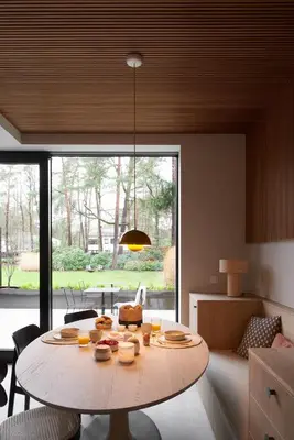 a living room with a table with food on it at The Pine House B&B in Schoten