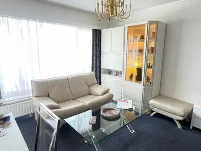 a living room with a couch and a glass table at - - - - - Au Sixième Ciel - - - - - in Brussels