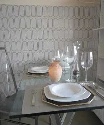 a table with plates and wine glasses on it at - - - - - Au Sixième Ciel - - - - - in Brussels