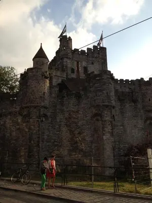 two people standing in front of a castle at B&B Tempelhof in Ghent