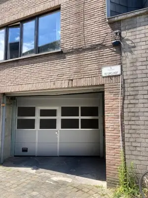 a garage door on a brick building at B&B Tempelhof in Ghent