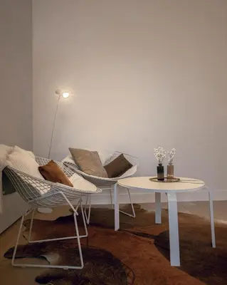 a living room with a chair and a table at ADA in Antwerp