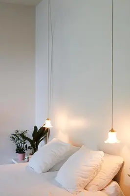 a bedroom with two white pillows on a bed at Chambre d'Amis by Alix in Ghent