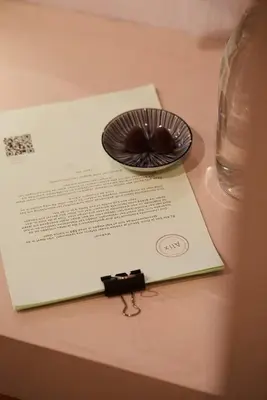 a plate on a paper on top of a table at Chambre d'Amis by Alix in Ghent