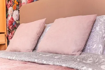 a bed with two pillows on top of it at Luxury Suites Boutique by Rikas Hotels in Antwerp