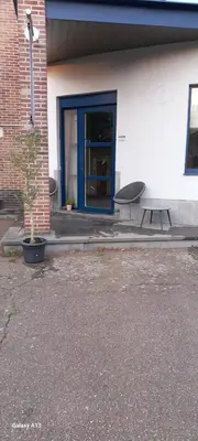 a picnic table and a bench in front of a building at Wenceslas cobergher appartement I in Boutersem