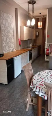 a kitchen with a table and a table and a dining room at Wenceslas cobergher appartement I in Boutersem