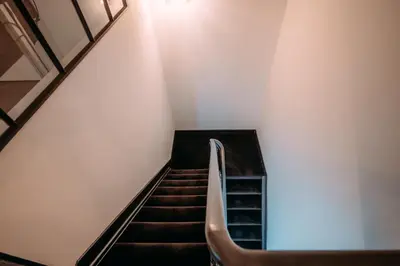 a staircase in a building with a stair case at Sud d'Anvers in Antwerp