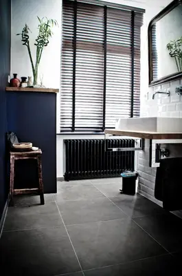 a bathroom with a sink and a large window at House Ninety Guesthouse in Brussels