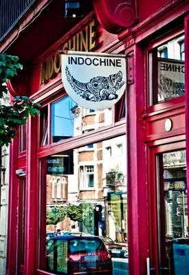 a red building with a sign on the side of it at House Ninety Guesthouse in Brussels