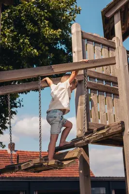 a young child is playing on a playground at POLE POLE - Ijsbeer in Lichtaart