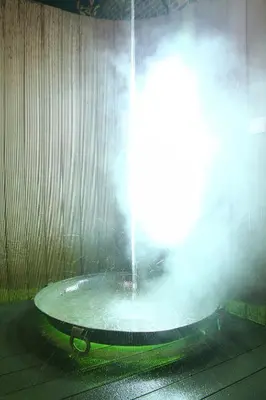 a water fountain with water coming out of it at B&B Casa Luna Loft in Dendermonde
