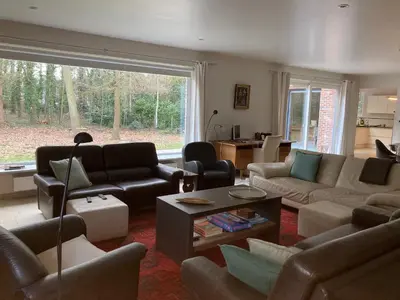 a living room filled with furniture and a large window at Hammo in Ham