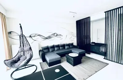 a living room with a couch and a hammock at Opera - Central Station, Flixbus, Airport Shuttle in Antwerp