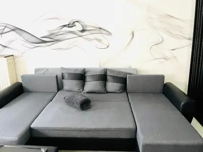 a couch in a room with a wall at Opera - Central Station, Flixbus, Airport Shuttle in Antwerp