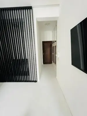 a hallway with a window and a television on a wall at Opera - Central Station, Flixbus, Airport Shuttle in Antwerp