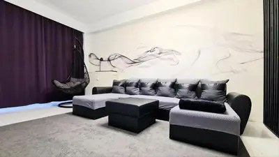a living room with a couch and a chair at Opera - Central Station, Flixbus, Airport Shuttle in Antwerp