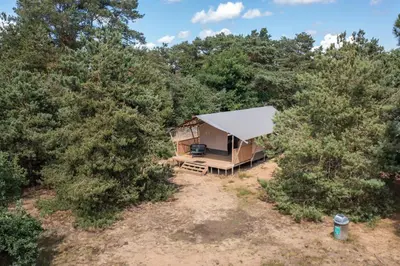 an overhead view of a tent in the woods at Recreatie- en Natuurpark Keiheuvel in Balen