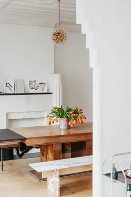 a dining room table with a potted plant on it at Huis Hector Mechiels ROOM in Sint-Niklaas