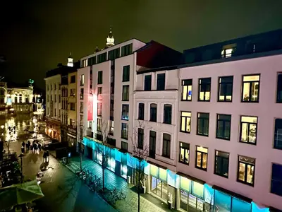 a group of buildings in a city at night at Luxury Suites Diamond by Rikas Hotels in Antwerp