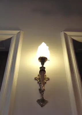 a light that is on a wall in a room at Atlas B&B in Ghent