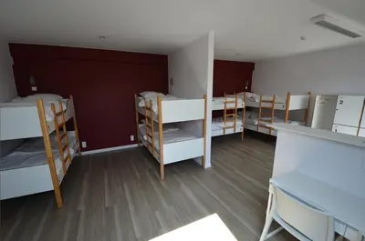 a group of bunk beds in a room at Auberge des 3 Fontaines - Youth Hostel in Brussels