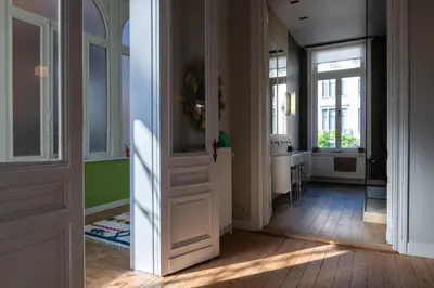 a hallway with a door leading to a bathroom at Garden of Eden in Antwerp
