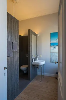 a bathroom with a sink and a toilet at Garden of Eden in Antwerp