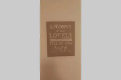 a sign that says welcome to our lovely full of love home at Easy comfort in Brussels