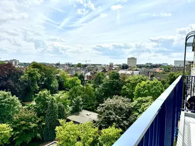 a balcony with a view of a city at Belga Apartment 3 bedrooms. in Antwerp